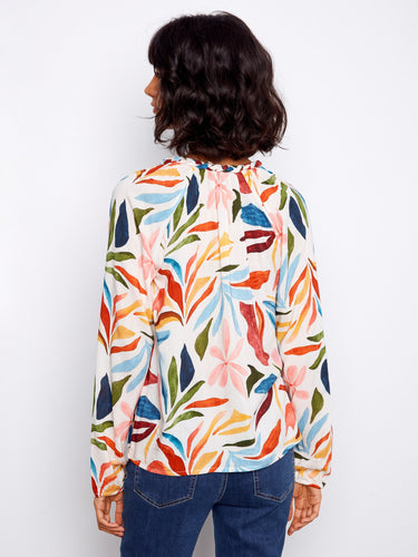 Trendy top featuring raglan sleeves in an eye-catching color palette, designed to elevate your fashion game by Charlie B.