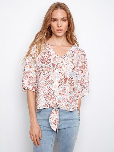 Stylish blouse showcasing a flattering V-neck and intricate print pattern for added charm by Charlie B.