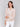 Blouse in papaya hue, highlighted by V-notch neckline and stylish patterns by Charlie B.