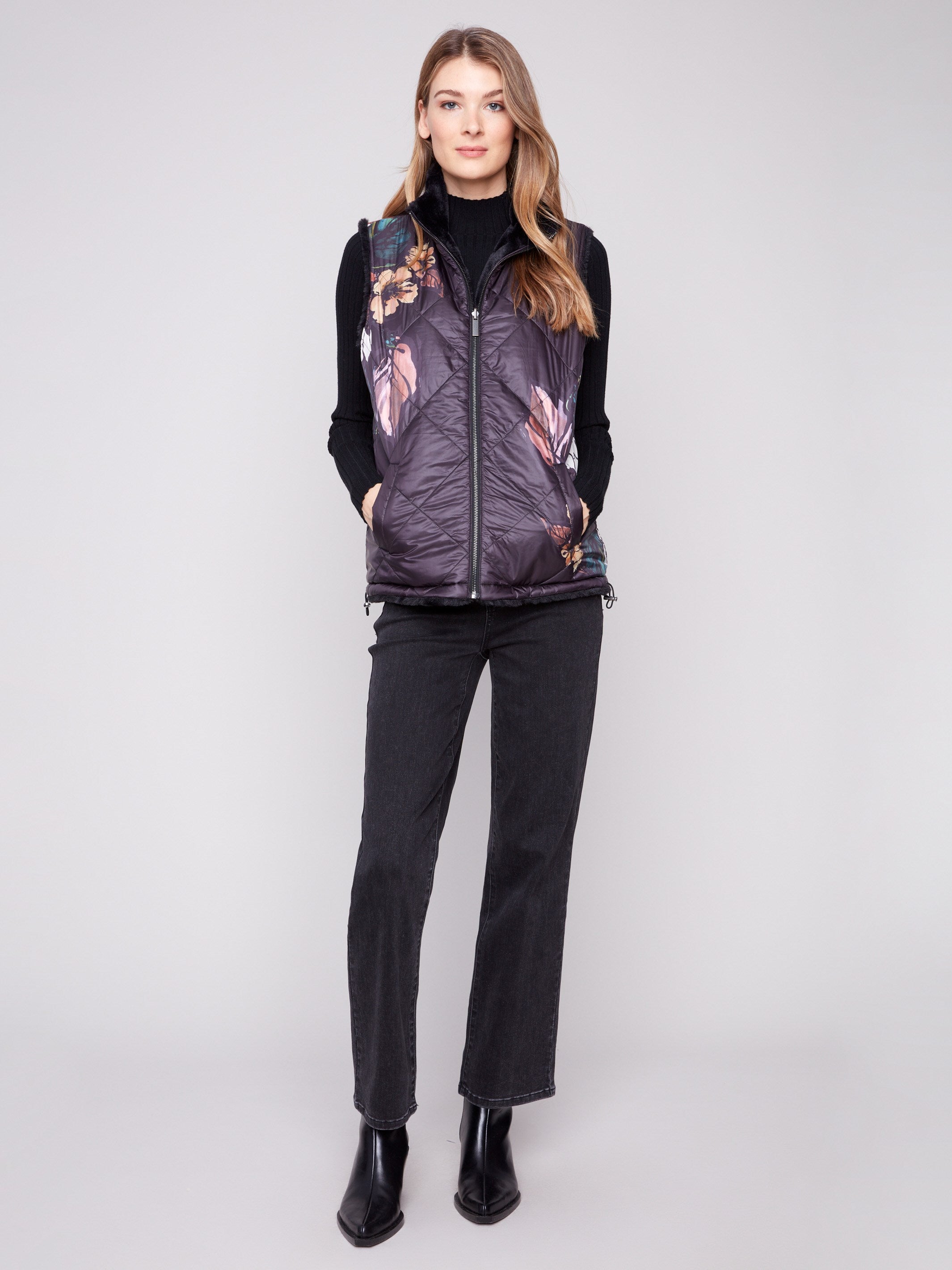 Quilted vest featuring a zipper front closure, ideal for layering and adding style to any outfit by Charlie B.