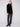 Plush black faux fur vest with welt pockets, offering both warmth and functionality by Charlie B.