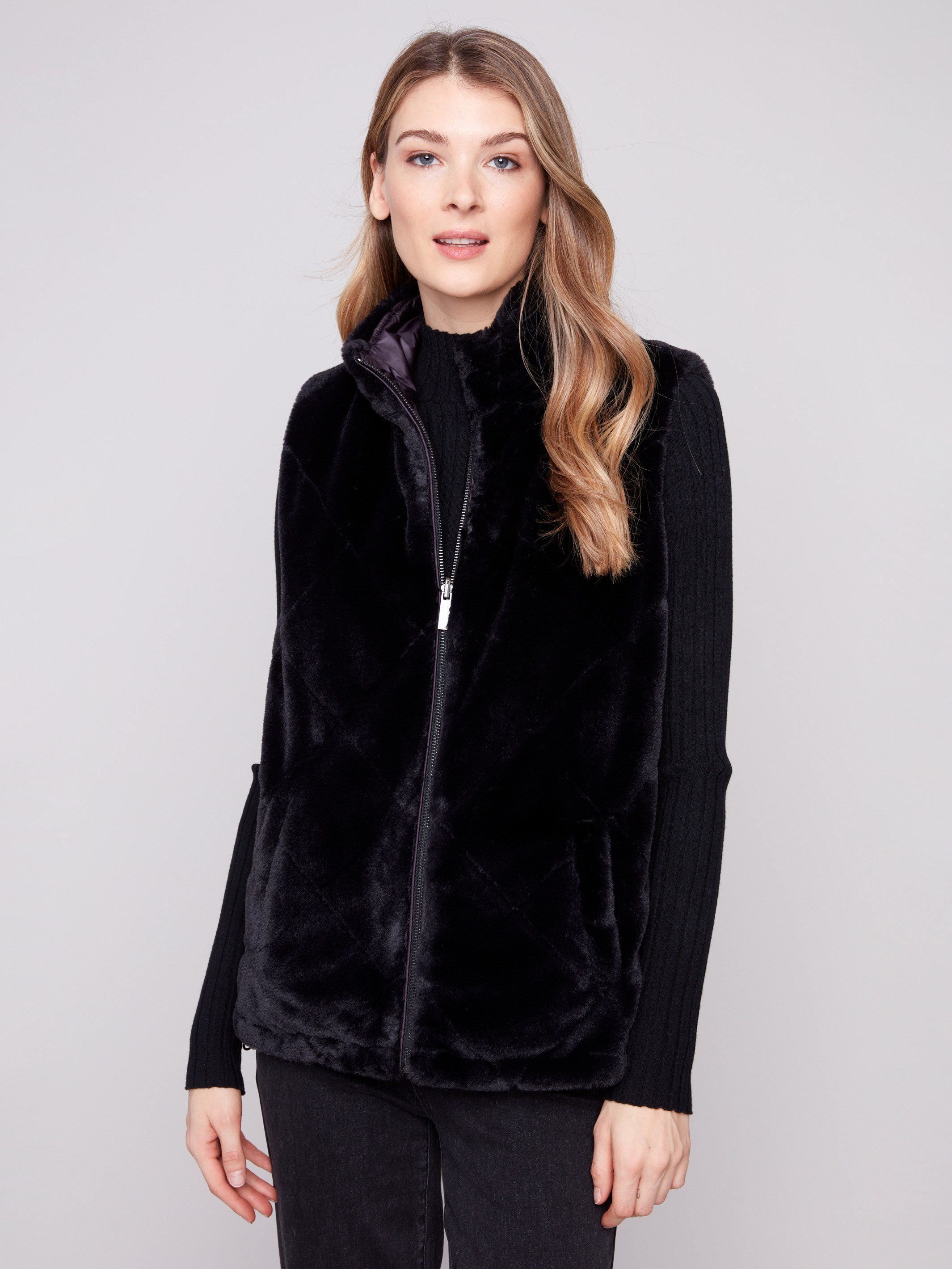 Soft faux fur design with a sleek zipper front, perfect for chic winter fashion by Charlie B.