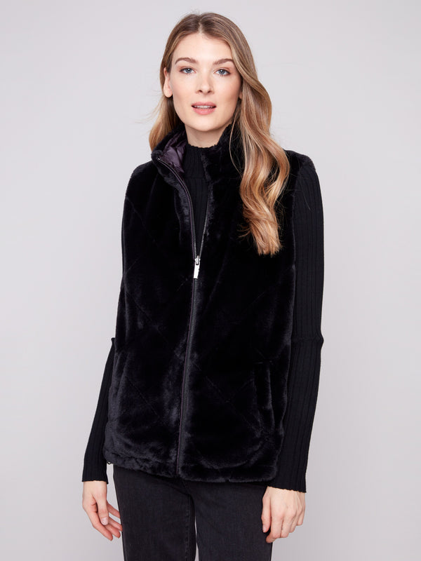 Soft faux fur design with a sleek zipper front, perfect for chic winter fashion by Charlie B.