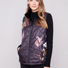 Floral print quilted vest with welt pockets for convenient storage on the go by Charlie B.