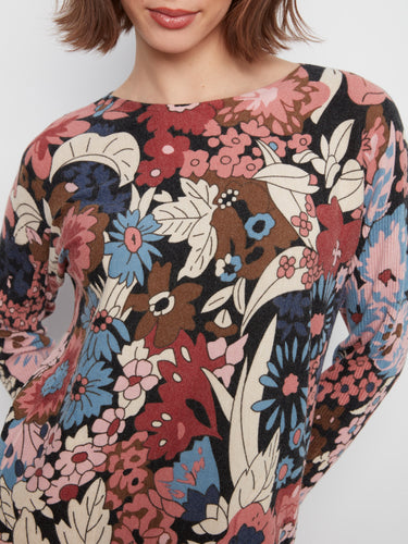The vibrant floral pattern is complemented by a rounded hem for added flair by Charlie B.