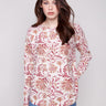 Sweater featuring an abstract floral design with a boat neck, offering a stylish and comfortable look by Charlie B.