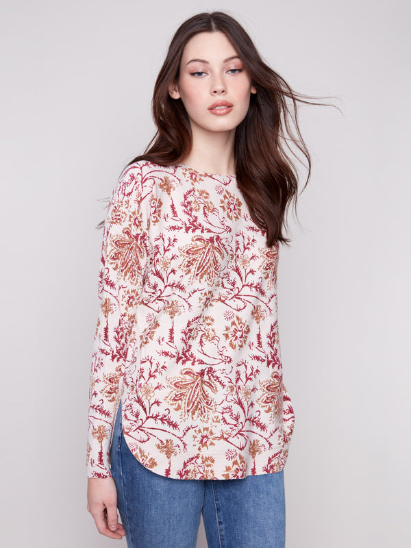 Stylish floral print sweater with convenient side pockets, combining fashion with functionality by Charlie B.