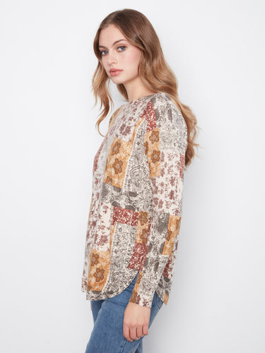 The rounded hem of this sweater enhances its relaxed fit, perfect for casual outings by Charlie B.