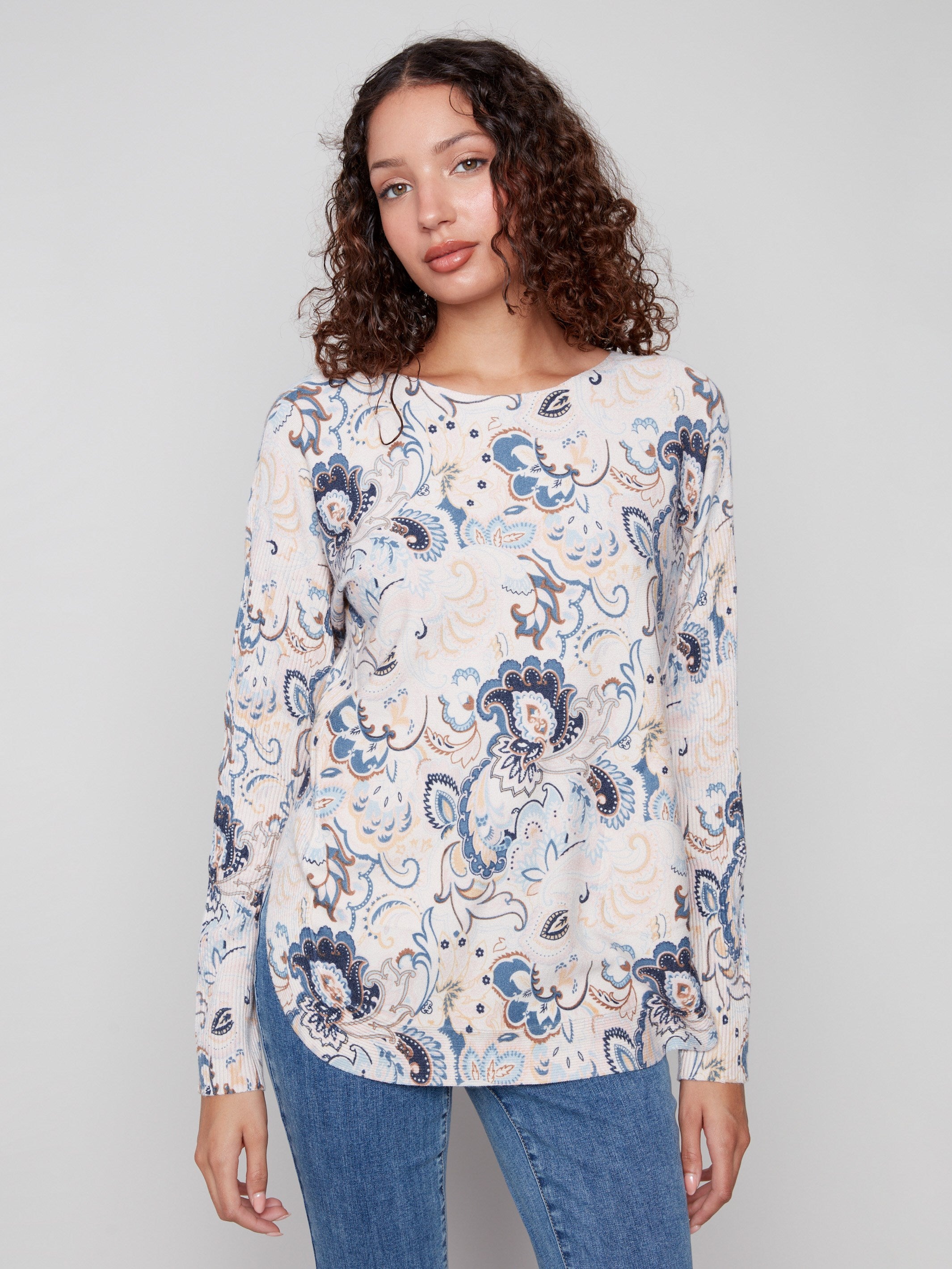 Sweater with a boat neck and abstract floral design, featuring ribbed sleeves for added texture by Charlie B.