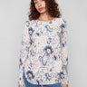Sweater with a boat neck and abstract floral design, featuring ribbed sleeves for added texture by Charlie B.