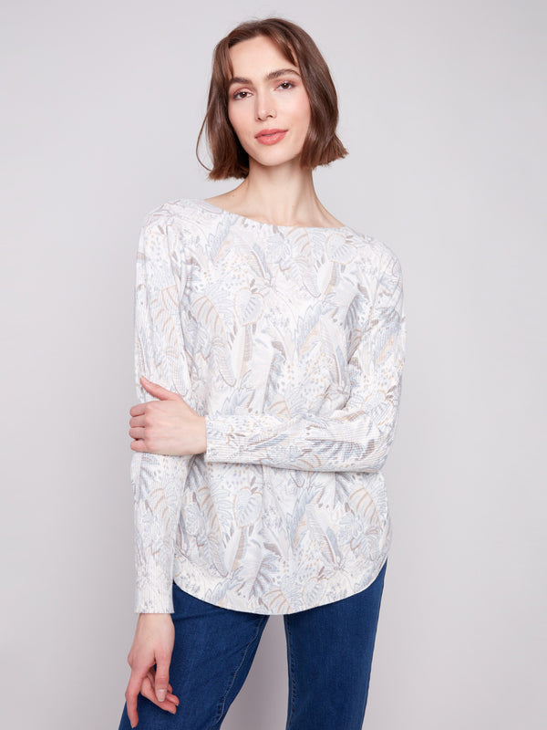 Elegant sweater featuring ribbed sleeves, adding texture and style by Charlie B.