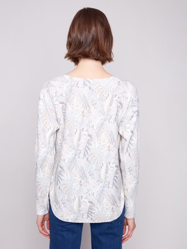 Stylish top with convenient side pockets for practicality and flair by Charlie B.