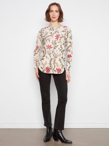 A beautifully crafted floral top with a rounded hem adds a touch of femininity to your wardrobe. By Charlie B.