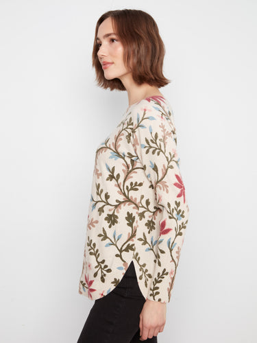 The boat neckline on this floral top enhances its classic design, making it versatile for any occasion. By Charlie B.