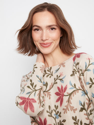 Rounded hem detail on this floral print adds sophistication to an already beautiful garment by Charlie B.