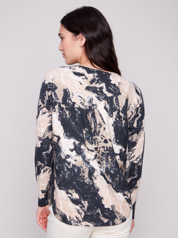 Featuring ribbed sleeves, this granite sweater combines comfort with a modern marbled print for versatile styling by Charlie B.
