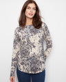 Elegant top with a boat neckline, featuring a unique pattern that adds sophistication to any outfit by Charlie B.