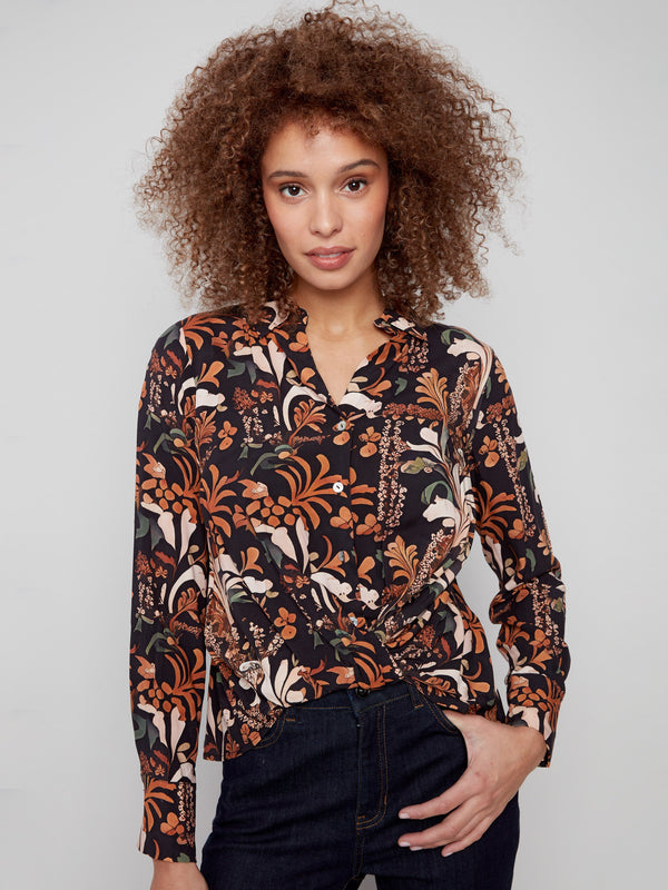 Button-down floral shirt with intricate patterns and long sleeves, perfect for casual or formal occasions by Charlie B.