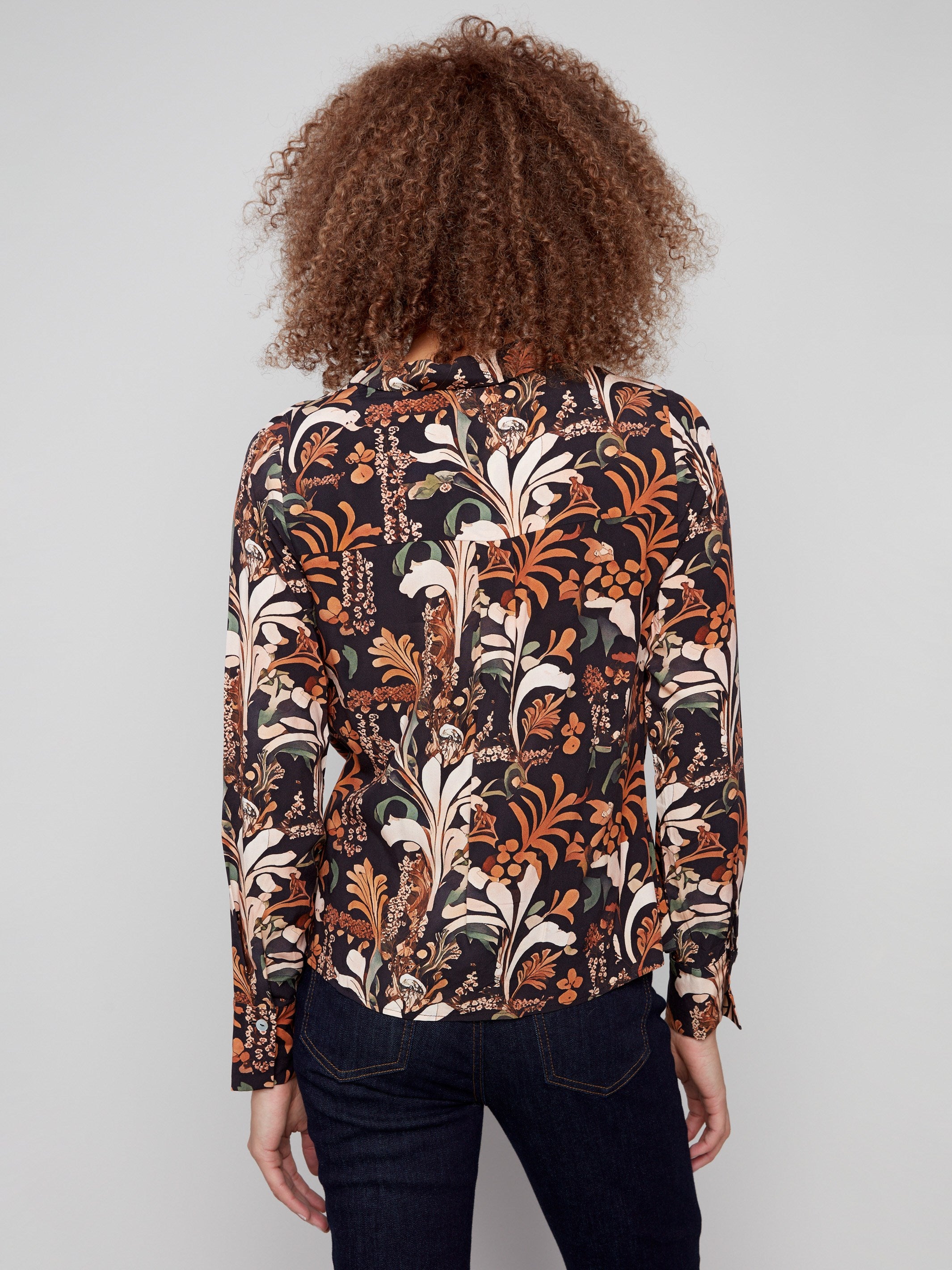 Stylish floral batik top showcasing a twisted front detail and elegant long sleeves for added sophistication by Charlie B.