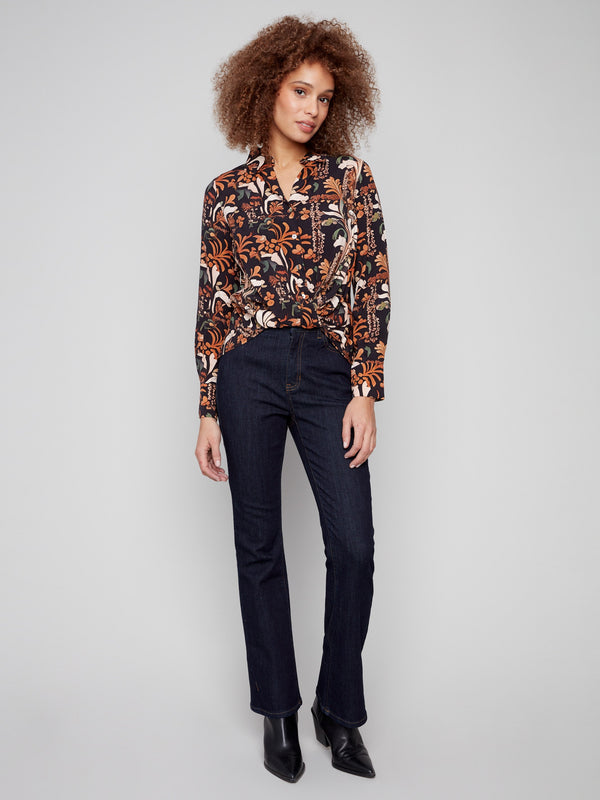 Elegant button-down blouse with vibrant floral patterns and classic shirt collar, ideal for versatile styling by Charlie B.