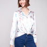 Satin shirt featuring soft satin fabric with a chevron print and a unique twisted front detail by Charlie B.