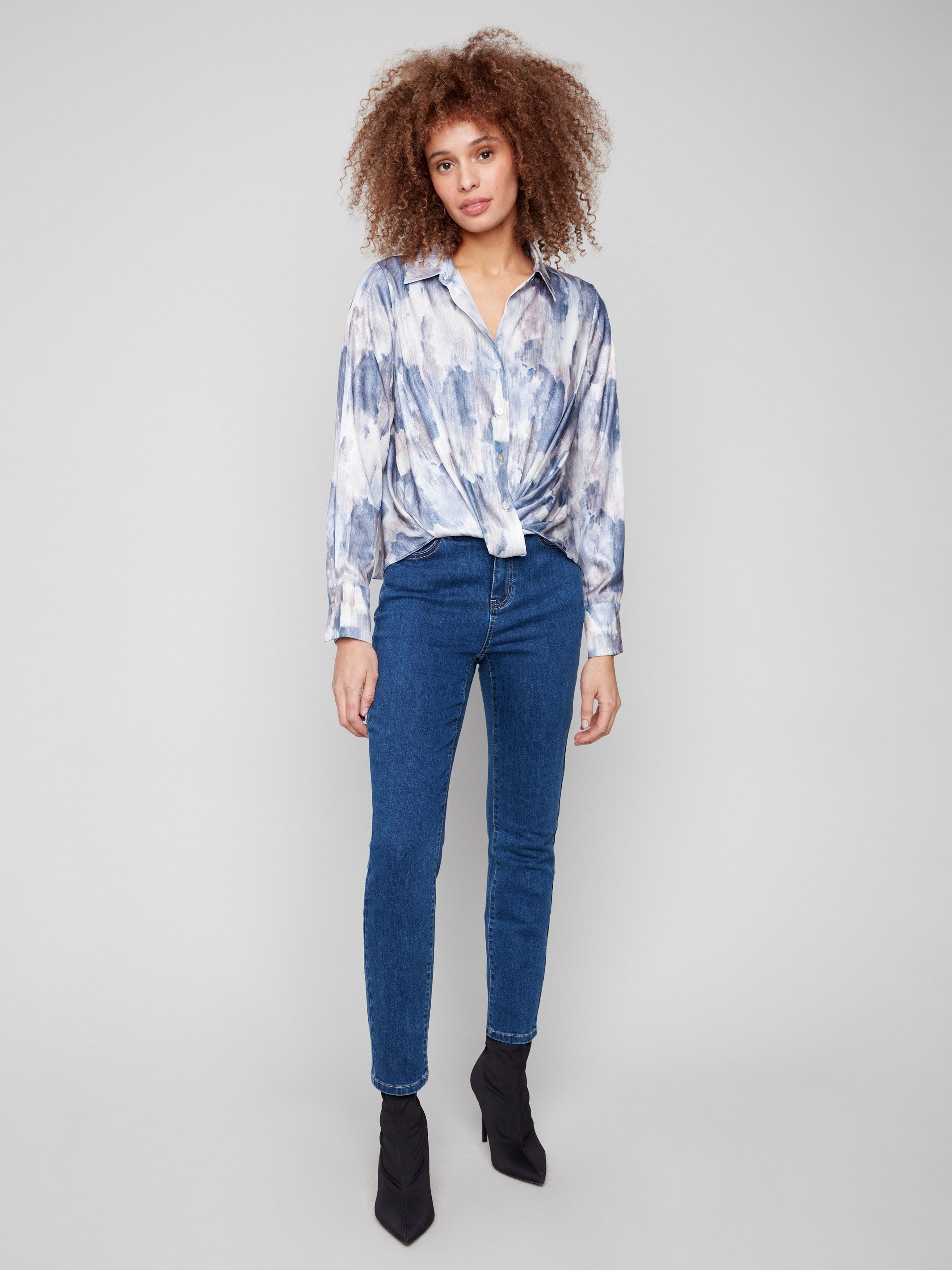 Elegant twisted front detail on this long sleeve satin shirt with button-down closure by Charlie B.