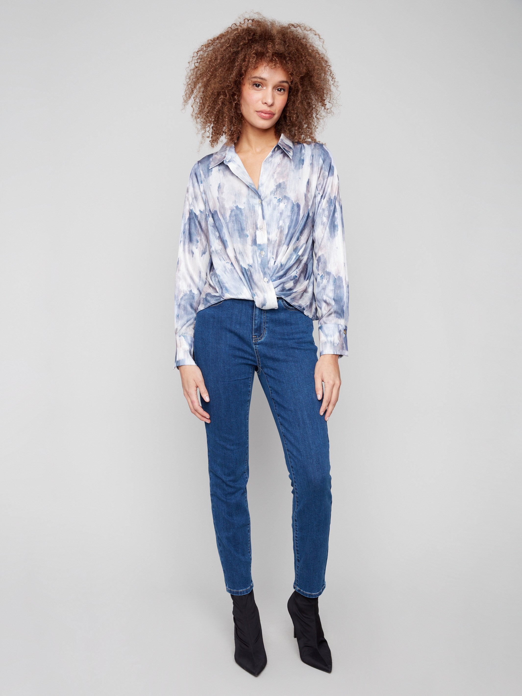 Chic button-down satin shirt showcasing an eye-catching abstract print and twisted design by Charlie B.