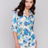 Lime green satin shirt with a collar and vibrant floral pattern by Charlie B.
