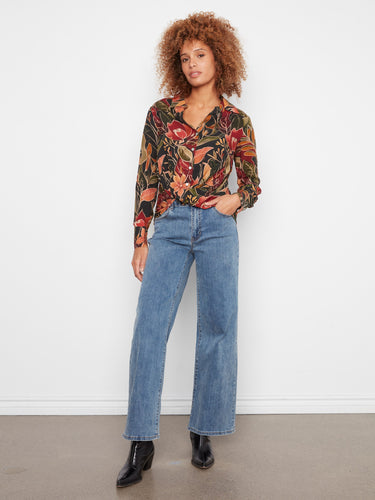Stylish floral blouse with twisted front detail adds a unique touch to your wardrobe. A blend of elegance and comfort by Charlie B.