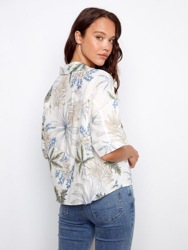 Elegant floral blouse with chest pockets and a classic shirt collar, ideal for adding flair to your wardrobe by Charlie B.