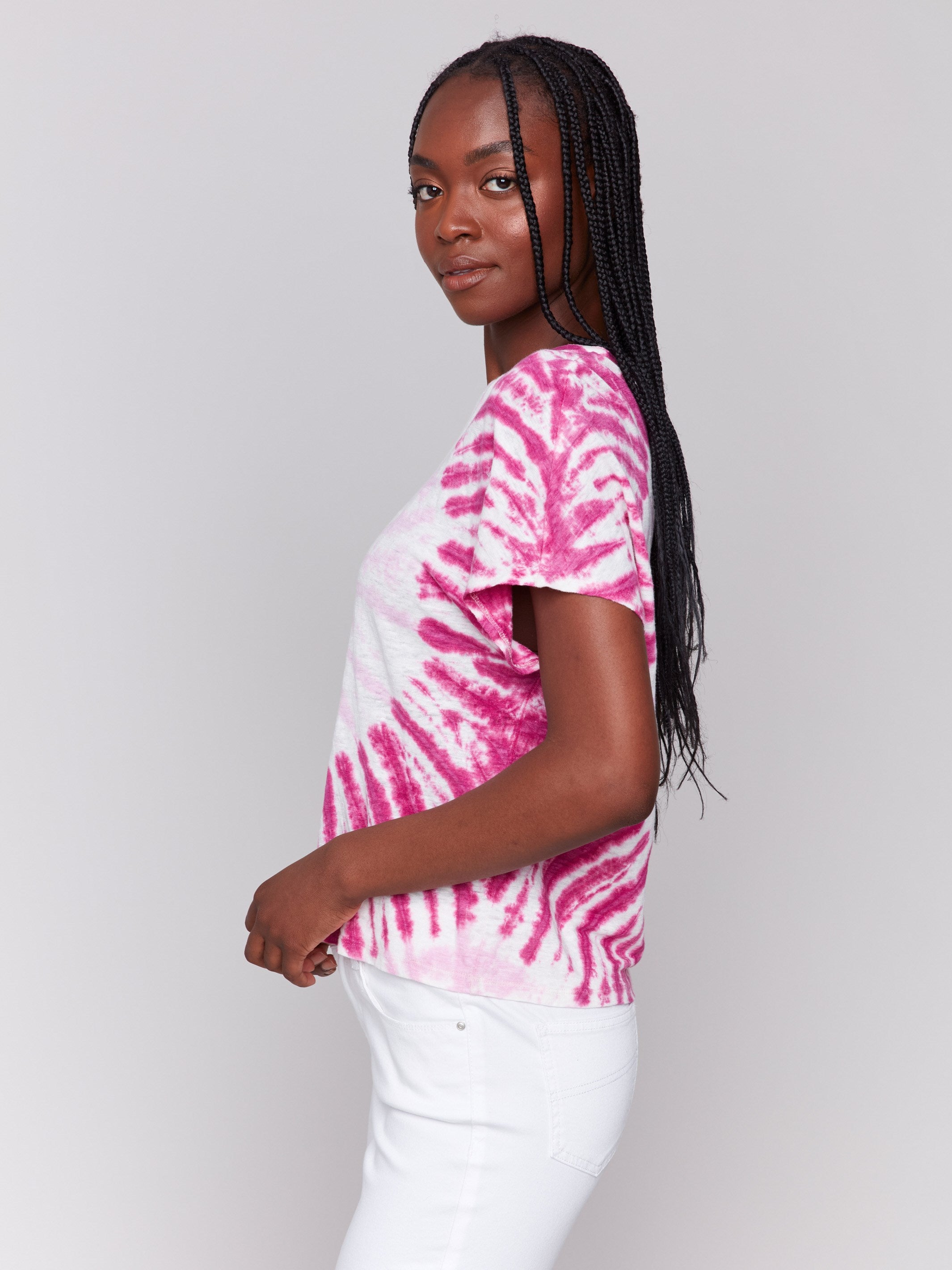 Spiral tie-dye pattern adds a unique touch to this chic pink dolman top by Charlie B.