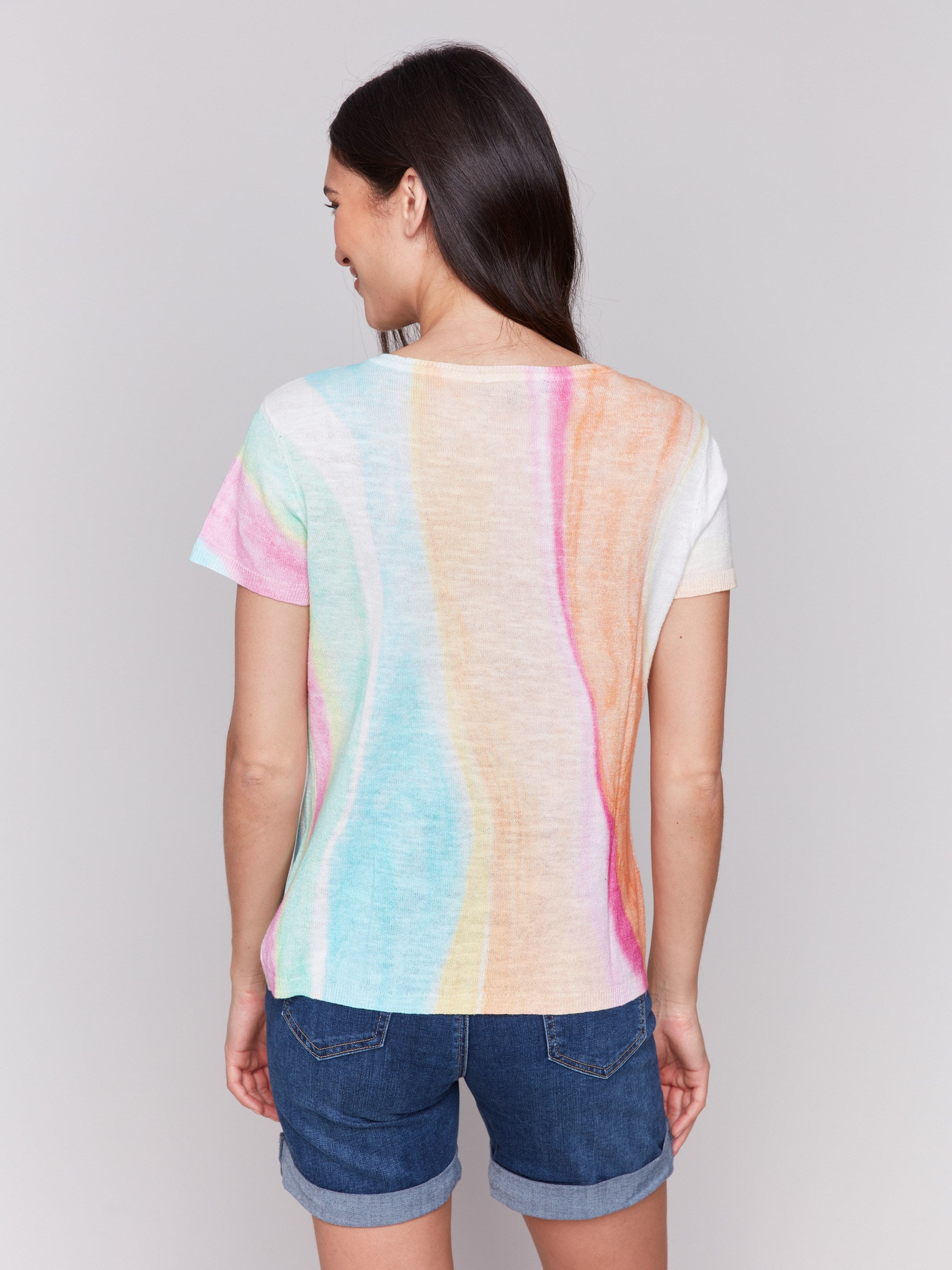 Vibrant rainbow-patterned sweater crafted from linen-cotton blend, offering both style and comfort by Charlie B.