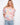 Floral top with an off-the-shoulder design and short flutter sleeves, offering a breezy summer look by Charlie B.