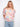 Floral top with an off-the-shoulder design and short flutter sleeves, offering a breezy summer look by Charlie B.
