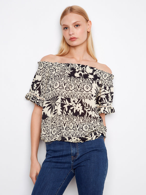 This top features an off-the-shoulder design, perfect for a relaxed yet stylish look. The floral pattern adds elegance by Charlie B.