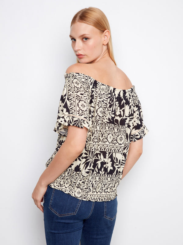 Off-the-shoulder style with floral patterns gives this top a feminine and trendy appeal, suitable for summer days by Charlie B.