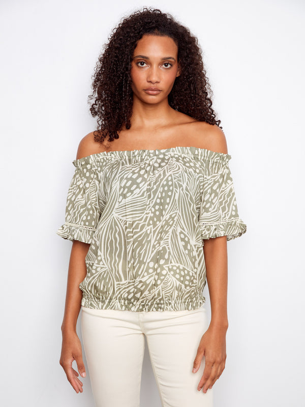 Elegant off-the-shoulder top with a chic pattern, perfect for casual outings. Features short flutter sleeves for added style by Charlie B.