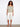 Trendy off-the-shoulder shirt with unique detailing, featuring a relaxed fit through its elastic hem and flutter sleeves by Charlie B.