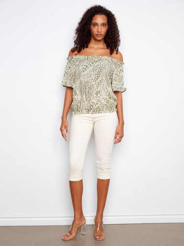 Trendy off-the-shoulder shirt with unique detailing, featuring a relaxed fit through its elastic hem and flutter sleeves by Charlie B.