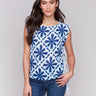 Blue and white blouse with crew neckline featuring geometric mosaic print by Charlie B.
