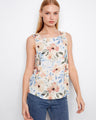 Floral sleeveless top with a scoop neckline, perfect for warm days. The design features a rounded hem for added style by Charlie B.
