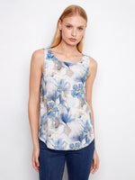 Floral top with a scoop neckline, showcasing a casual elegance. Perfect for warm days or layering in cooler weather by Charlie B.