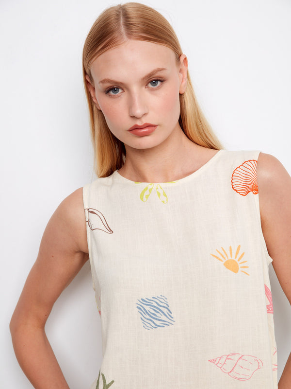 This sleeveless linen blend top showcases an ocean-themed print and a chic crew neckline by Charlie B.