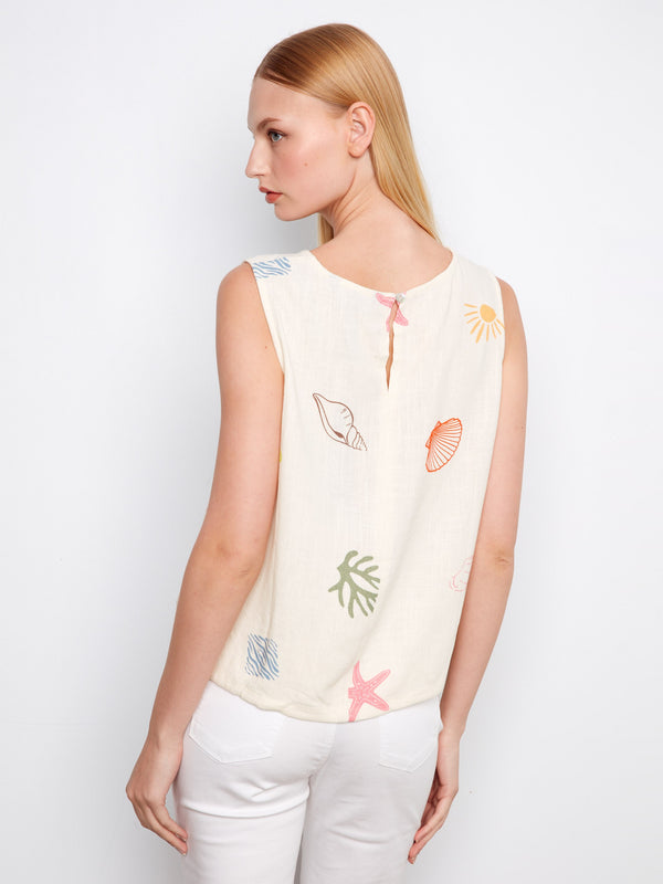 Charming linen blend top adorned with vibrant ocean prints and a versatile drawcord hem for easy styling by Charlie B.