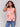 Coral sleeveless top with a crew neckline and abstract print by Charlie B.