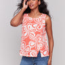 Coral sleeveless top with a crew neckline and abstract print by Charlie B.