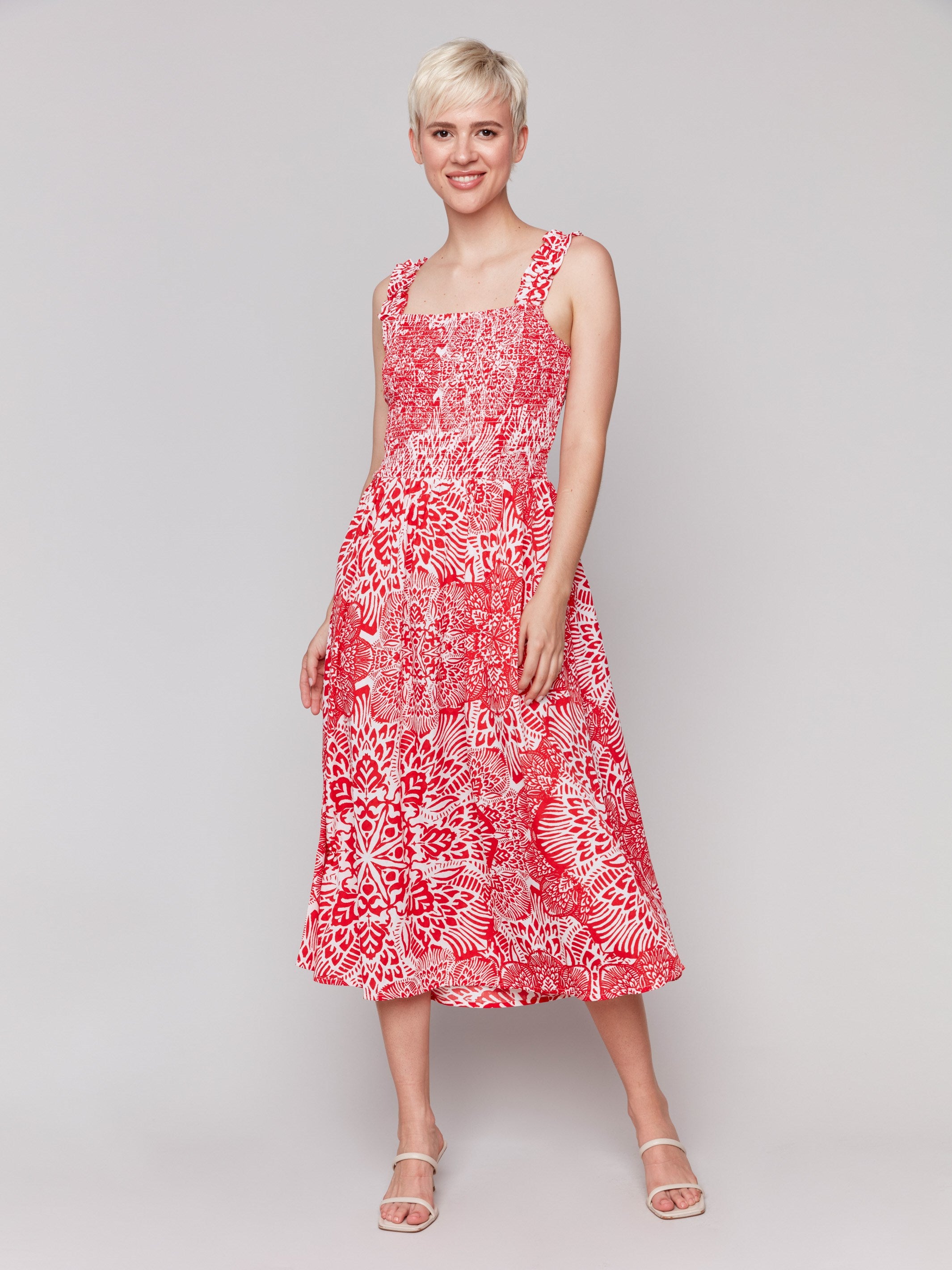 Red and white printed midi dress with shirring detail at bodice by Charlie B.