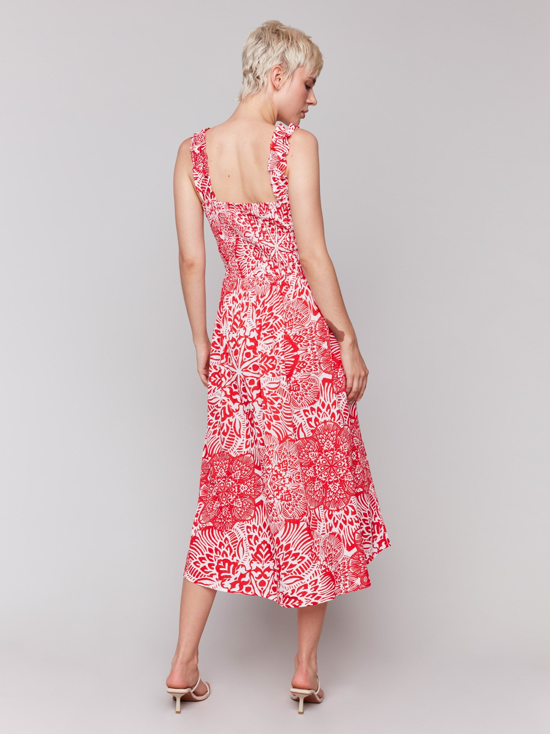 Shirring detail enhances this red and white printed midi dress by Charlie B.