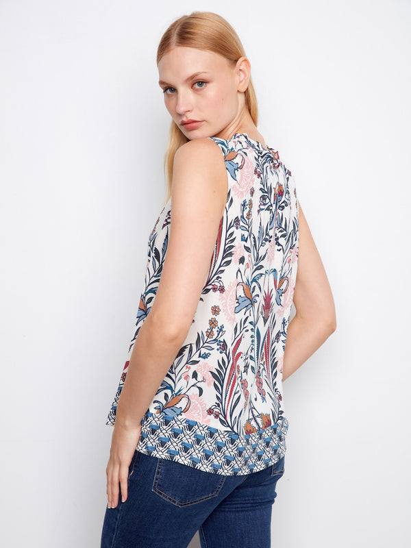 Sleeveless V-neck blouse showcasing a unique abstract border print by Charlie B.