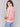 Blouse featuring a ruffle neckline in clementine and pink by Charlie B.